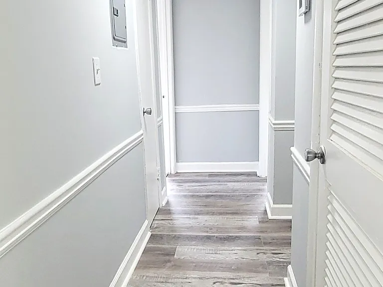 Bright, elegant hallway with a modern remodel