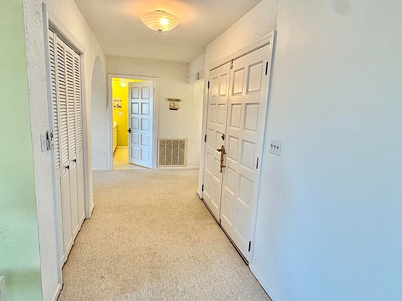 FRONT DOOR ENTRANCE AND COAT CLOSET