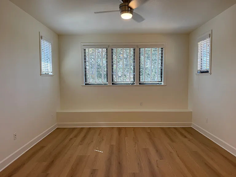 Fourth bedroom is on the third floor with a bathroom across the hallway. The fourth bedroom features a ceiling fan with 2 walk-in closets.