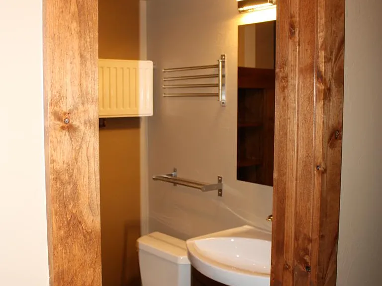 Bathroom with vanity under sink, medicine cabinet on wall with nice mirror.