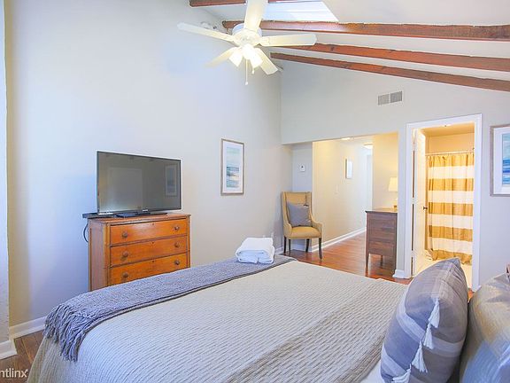 Enjoy the flat screen TV from bed.