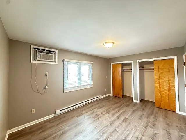 Double closets, A. C. unit, and new double windows, viewing the ocean in a spacious bedroom.