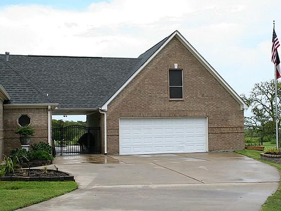 Over sized garage will hold all your toys and has a rear full sized pull down door.