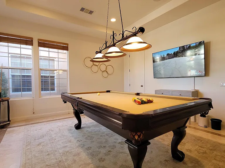 Large play area with pool table, roulette table, large TV