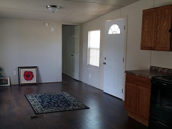Den with Hardwood floors