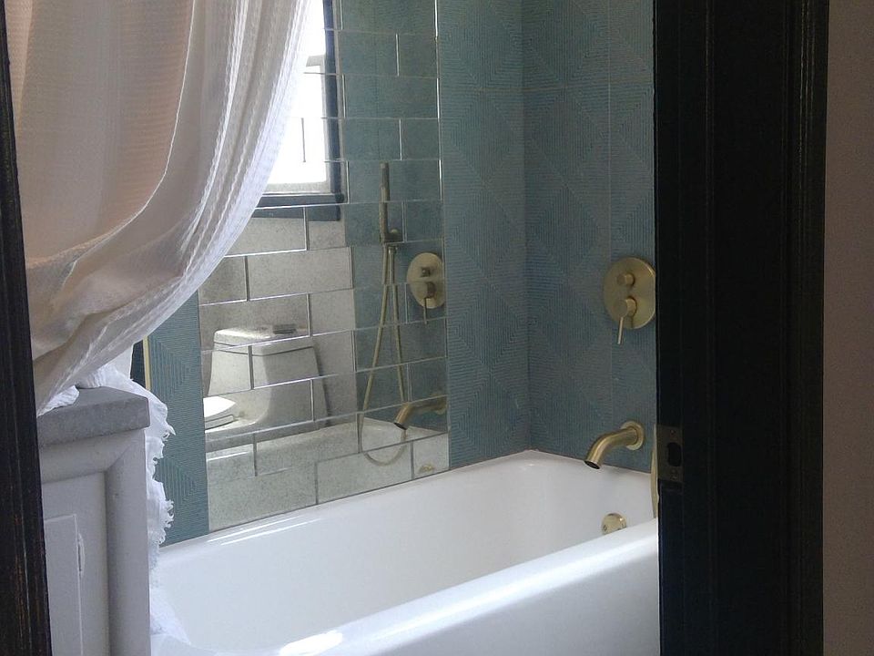 596 Photo will be uploaded soon - All bathrooms are the same size. Tile varies. The same designer updated each unit so each is unique, always using quality materials.
