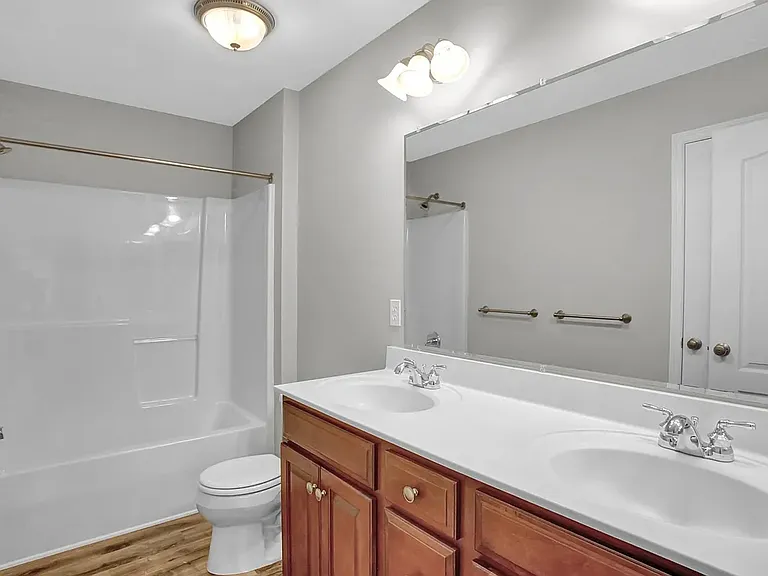 Both the master and guest bathrooms are nearly identical with a double vanity.