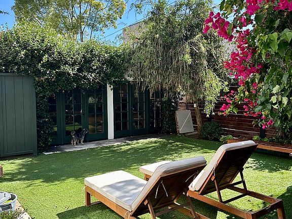 Your private backyard. Private office behind those glass french doors.