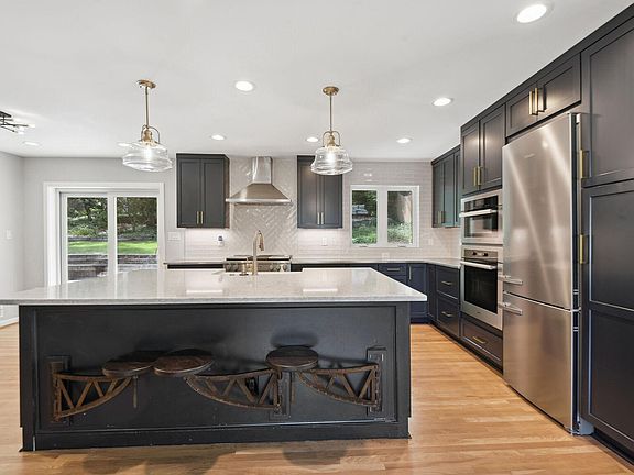 kitchen with large island and superior appliances