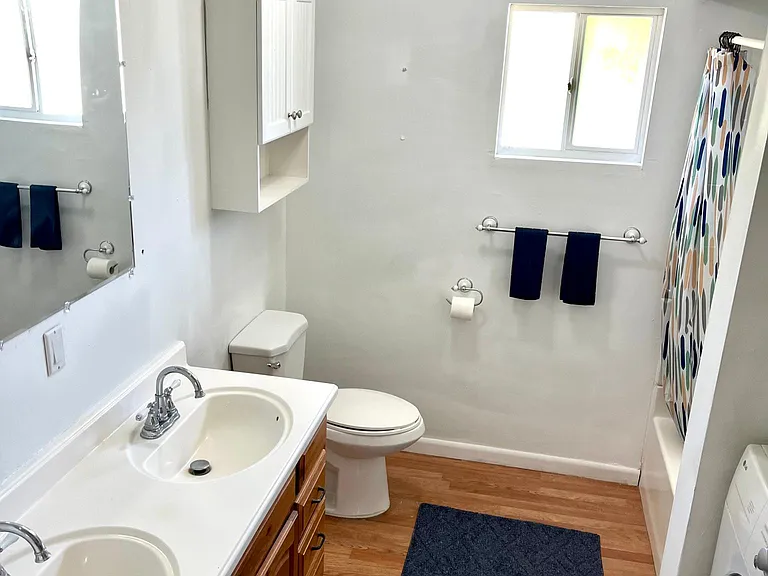 Double sinks, indoor laundry, tub/shower.