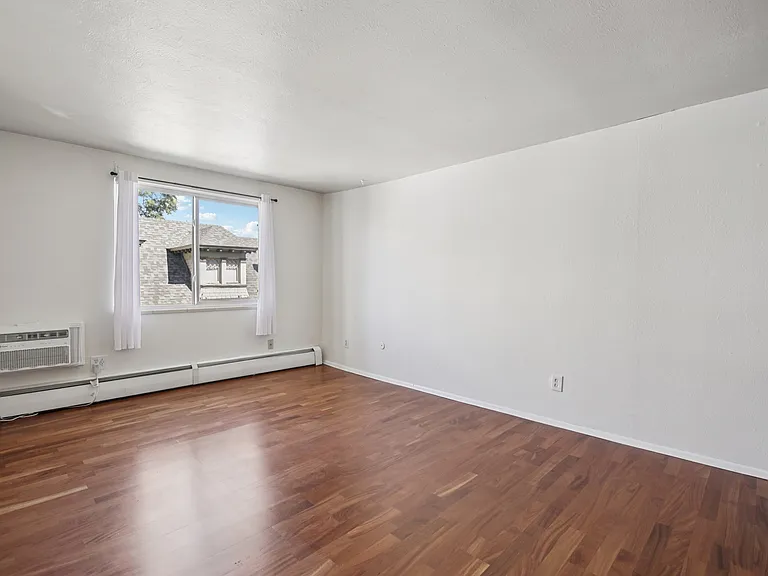 Living room, unfurnished, from hallway