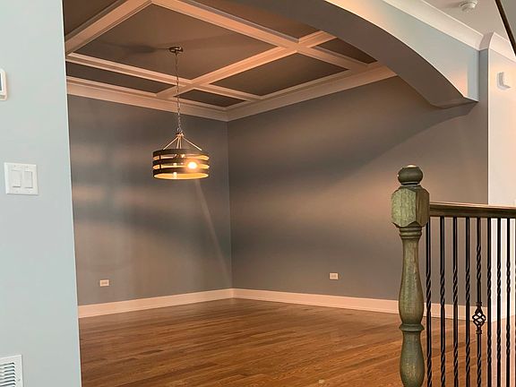 hardwood flooring with modern ceiling treatments