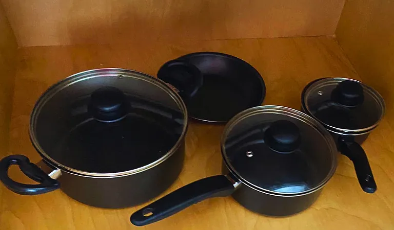 Kitchen includes all essentials such as pots, pans, and cooking utensils.