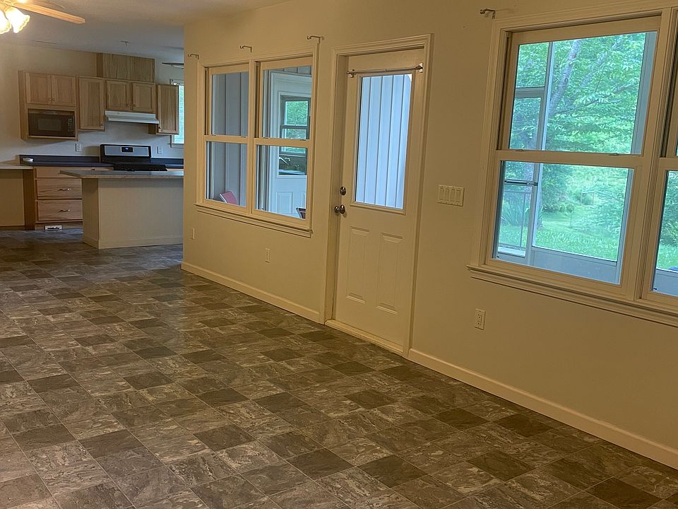Living Area ( front door leading out onto screened in porch )