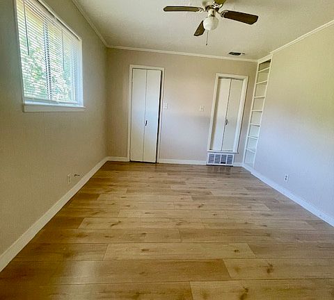 Bedroom #1 with double closets and built in book shelf.