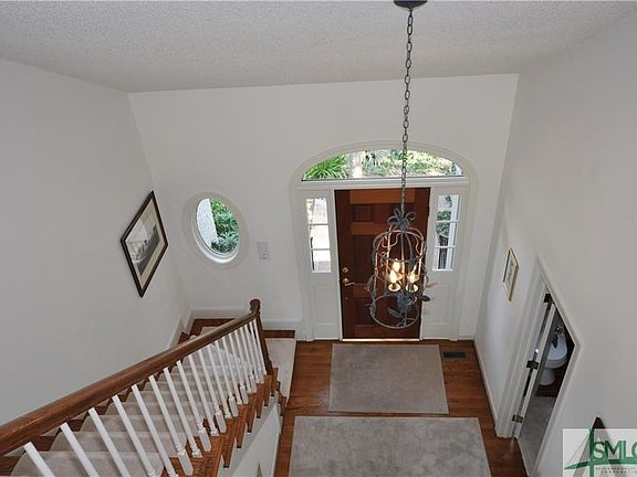 Foyer with volume ceiling