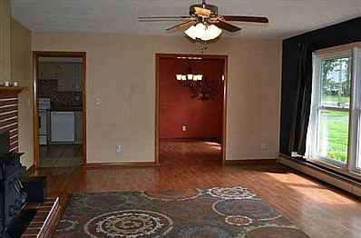Great Room. Great Room with newer Flooring and Wood Burning Fireplace.