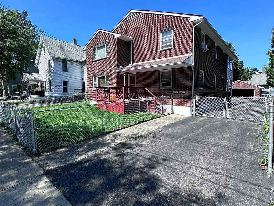 View of totally fenced in property, including driveway gate
Seating available on front porch /viewing
