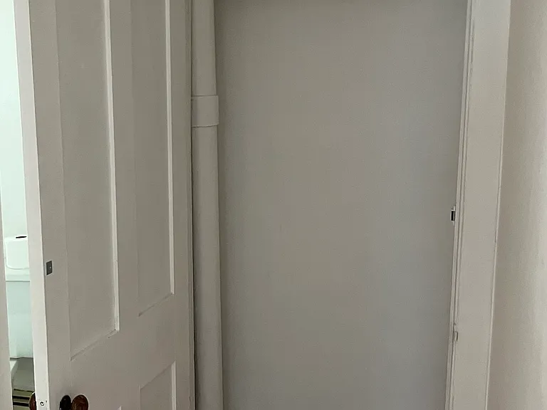 Hall closet, bath left