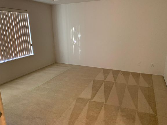 master bed room with large window