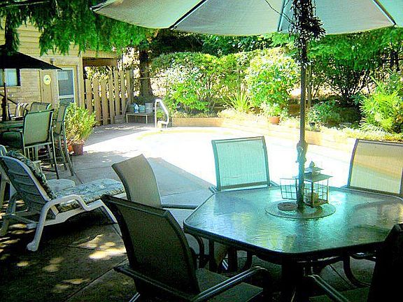 Deck by in-ground pool