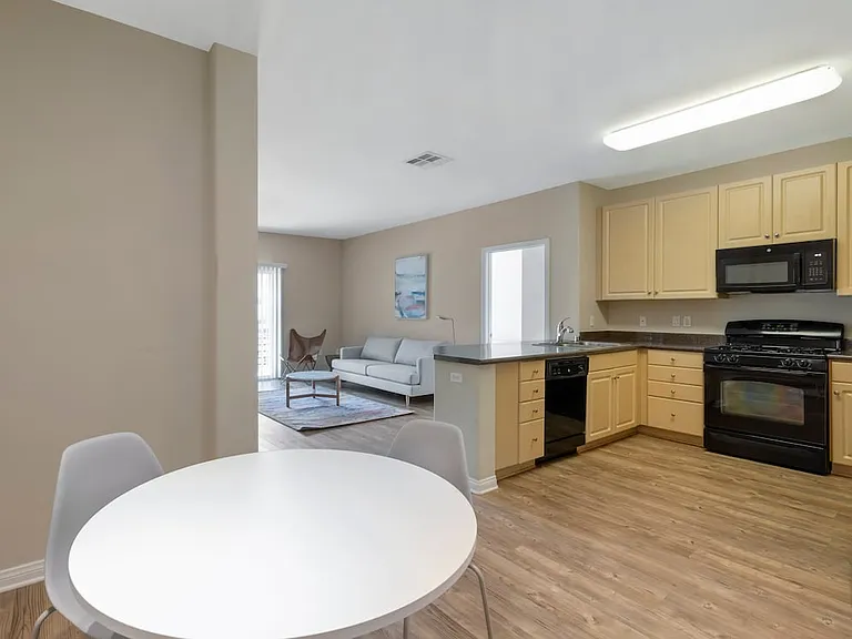 Furnished+ apartment homes include a dining set (Representative Image exact items and style of furnishings may vary)
