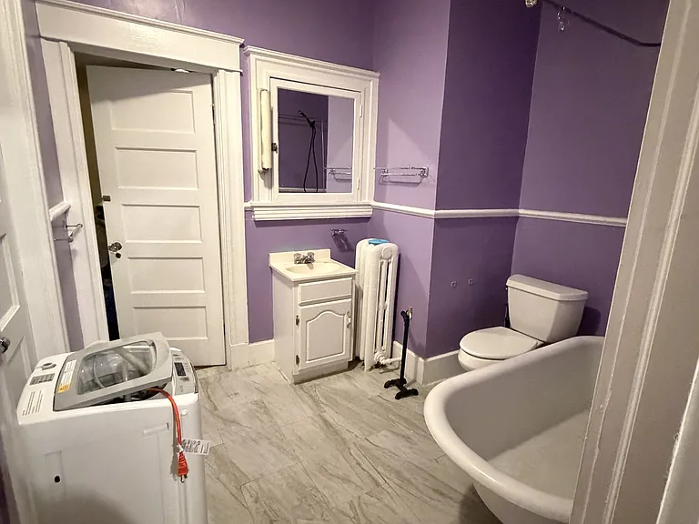 Large Bathroom with Washer. Nice Skylight, clawfoot tub, new floor.