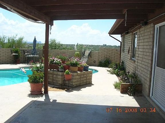 More of the pool with a planter