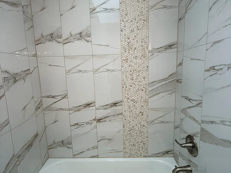 Upstairs tub/shower with custom tile inlay