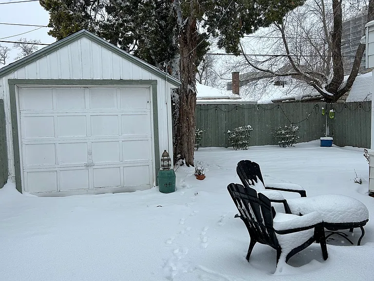 Back garden in winter. Garage good for storage.