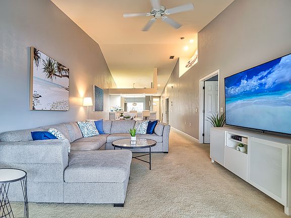 Living room with sectional and 75" TV