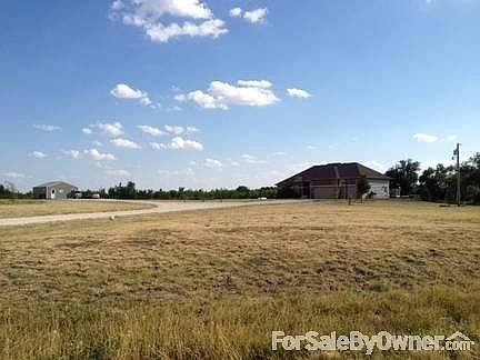 Road view of house and shop
						:
						5 acre tract 1/4 mile off black top road.