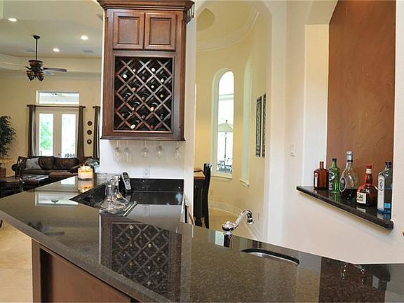 This wet bar/wine bar lets you entertain your guests in style - the ice maker keeps the cubes coming