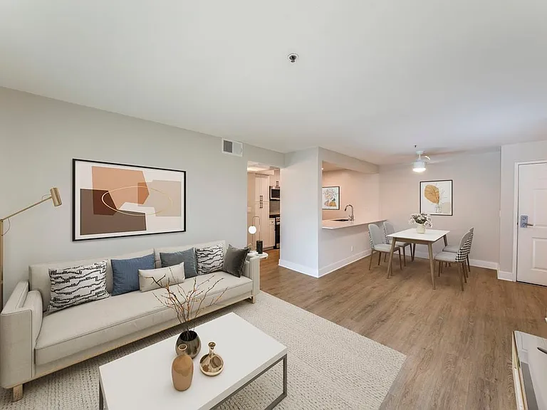 Renovated Package I dining and living room with hard surface flooring