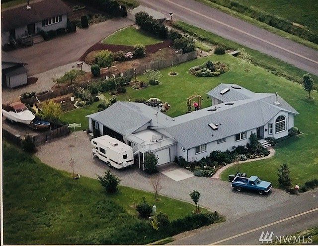 Charming 3 bd/2 bath home,sun room, upper level viewing deck, three car garage, sun room with mountain and ocean views.