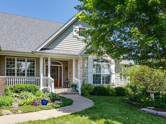 A beautiful front entrance perfectly surrounded by perennials to greet your guests.