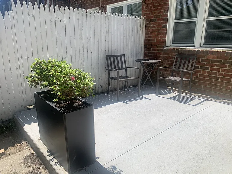 New patio with planters and outdoor furniture