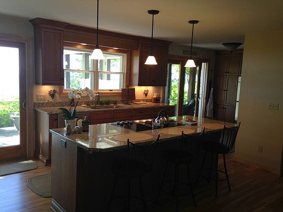 Great entertaining space : The recently updated kitchen has an oversized island- a great gathering p