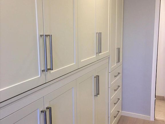 Closet space with single murphy bed built into the wall