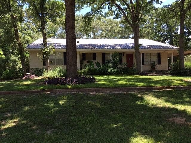 House is situated on 4 wooded lots.
