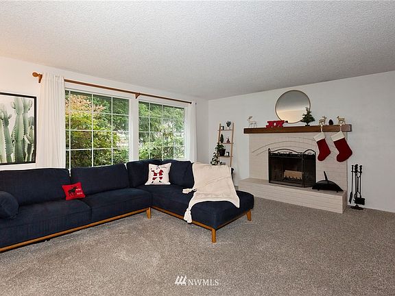 Spacious living space with wood burning fireplace