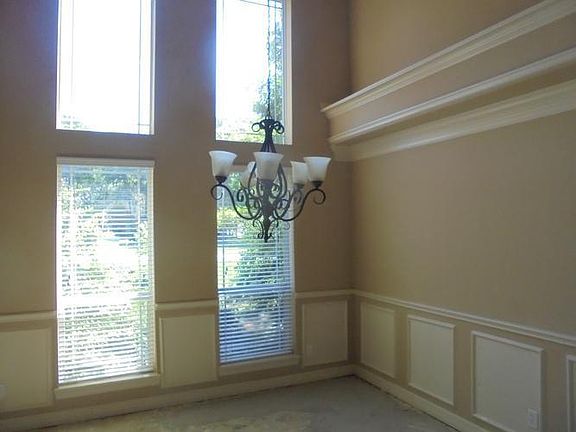 The formal dining room features 2 story ceiling, w