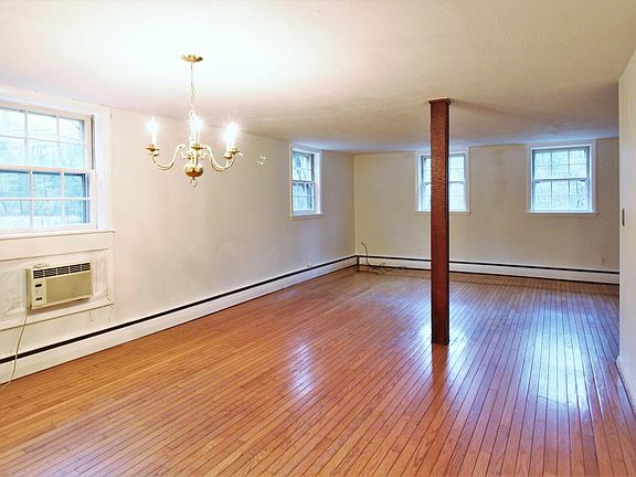 Large living room with space for dining room table too! Windows look towards backyard.
