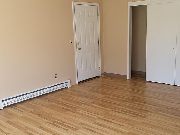 Enjoy the outdoor front entry directly in to your home with wood floors throughout the first floor. A closet the length of the wall provides for lots of storage.