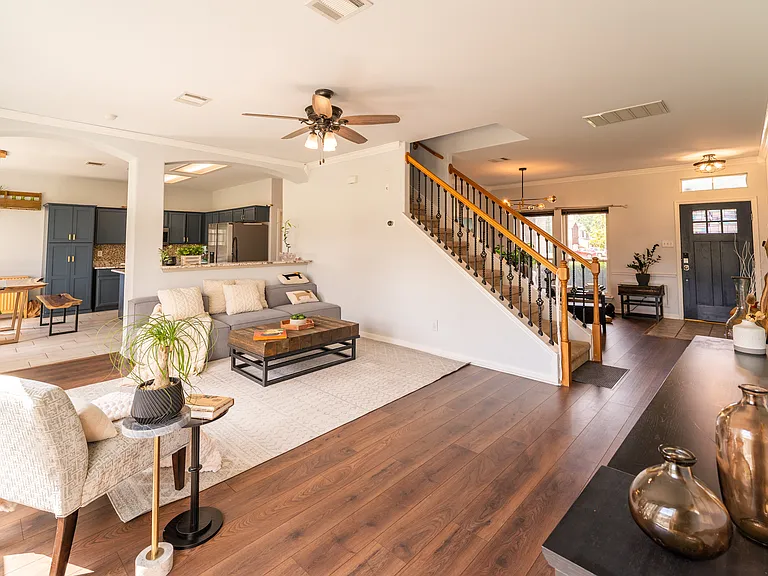 Spacious Open-Concept Living: A wide-open, inviting main floor featuring beautiful hardwood flooring. The seamless flow between the living room, dining area, and kitchen makes it perfect for both daily living and entertaining.