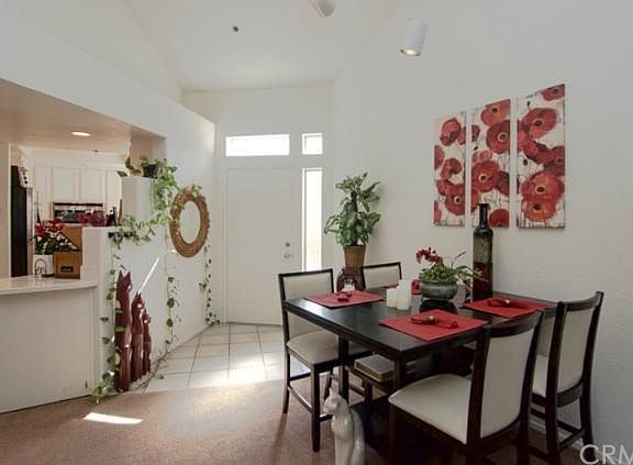 Formal tile entry opens up to the bright and open dining area.