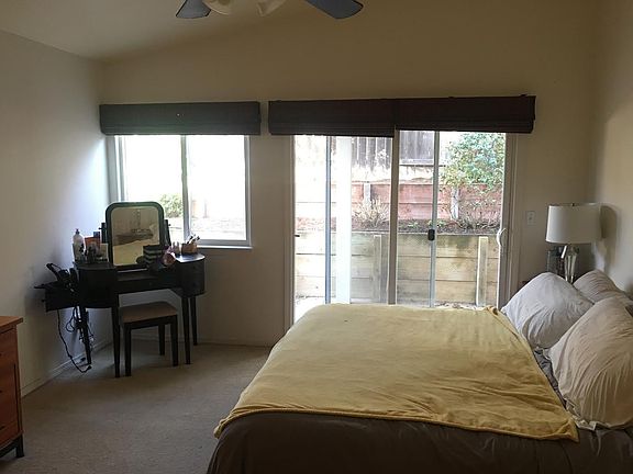 Master bedroom with sliding door to side yard