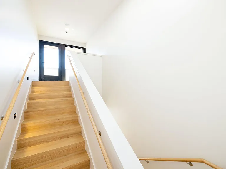 View of the stairs going to the roof top terrace.