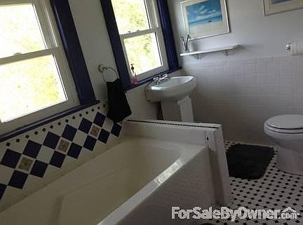 Upstairs Master Bath
						:
						6ft. soaking tub with custom ceramic tile in cobalt and white.