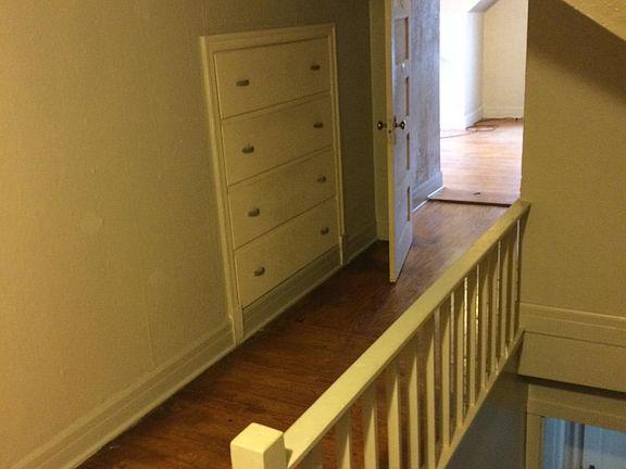 STAIRCASE WITH CUSTOM BUILT-IN DRESSOR IN HALLWAY